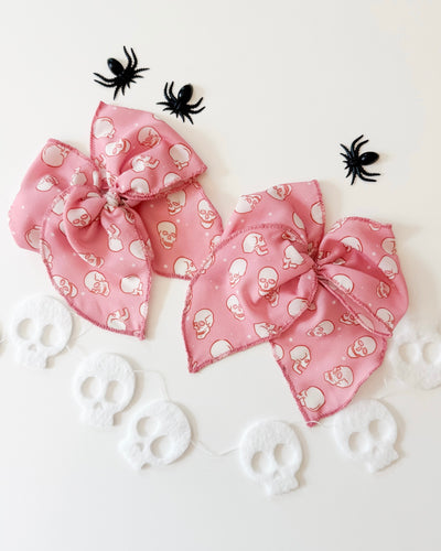 PINK SKELLIES • bow